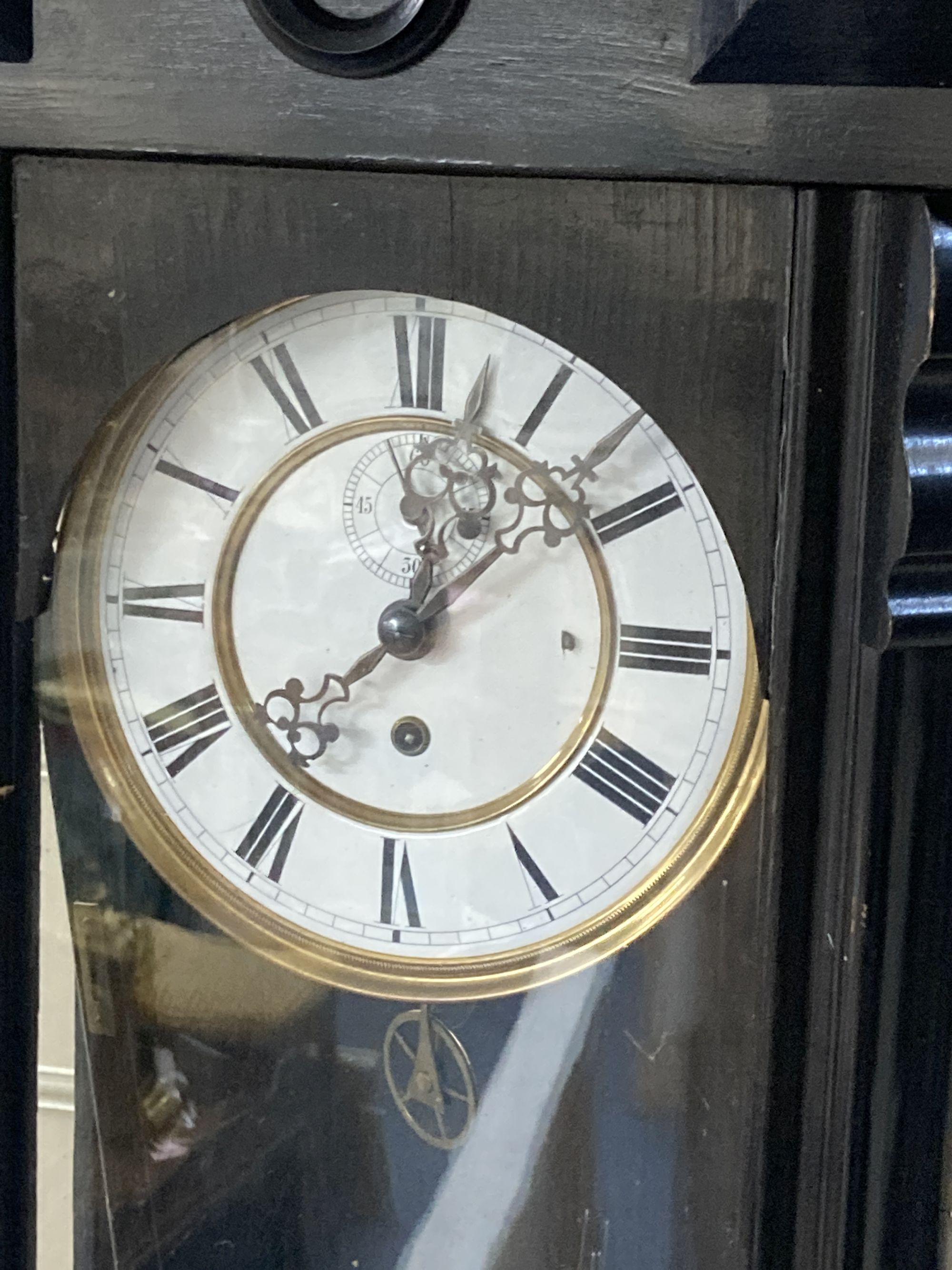 An early 20th century ebonised Vienna wall clock, height 106cm